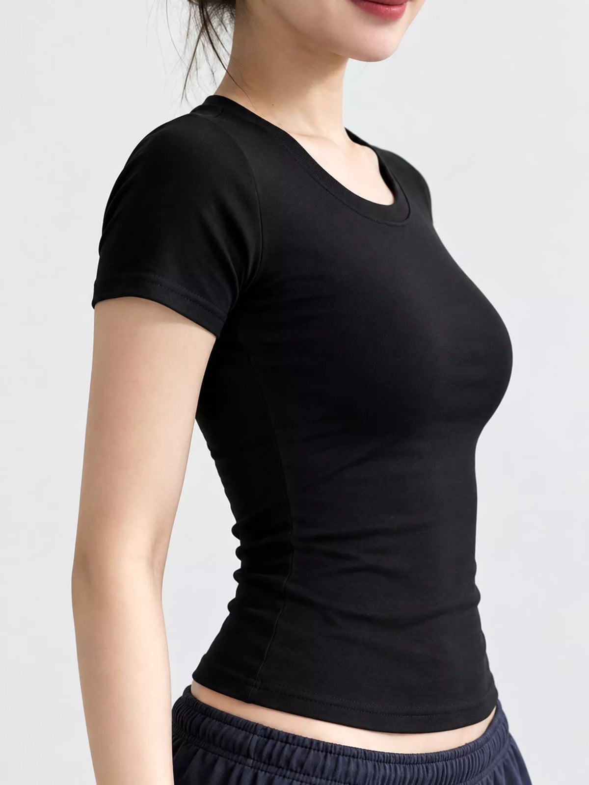 Black slim-fit crew neck T-shirt, side view
