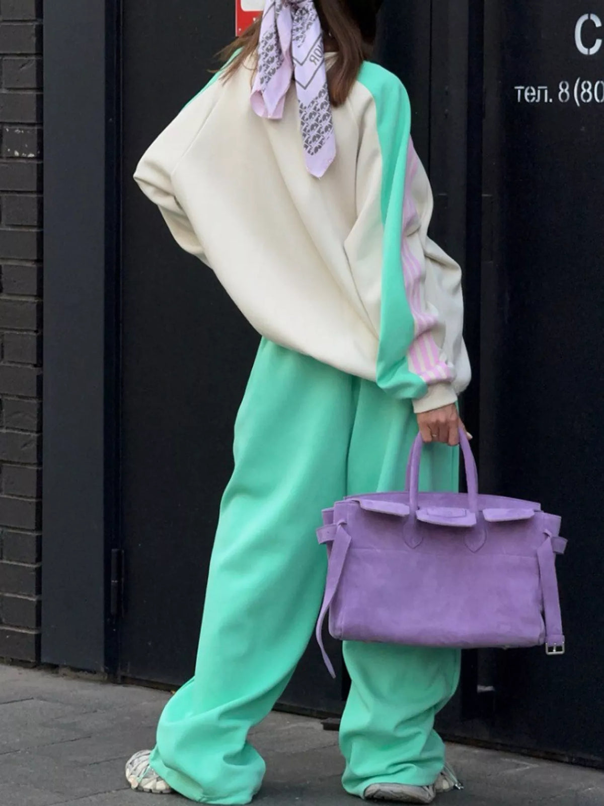 Cream top and green pants color-block sweatshirt and wide-leg pants set — front view