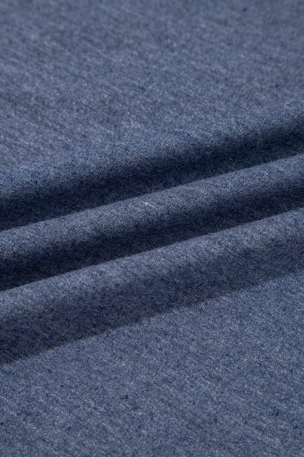 Top and drawstring pants set, blue fabric close up