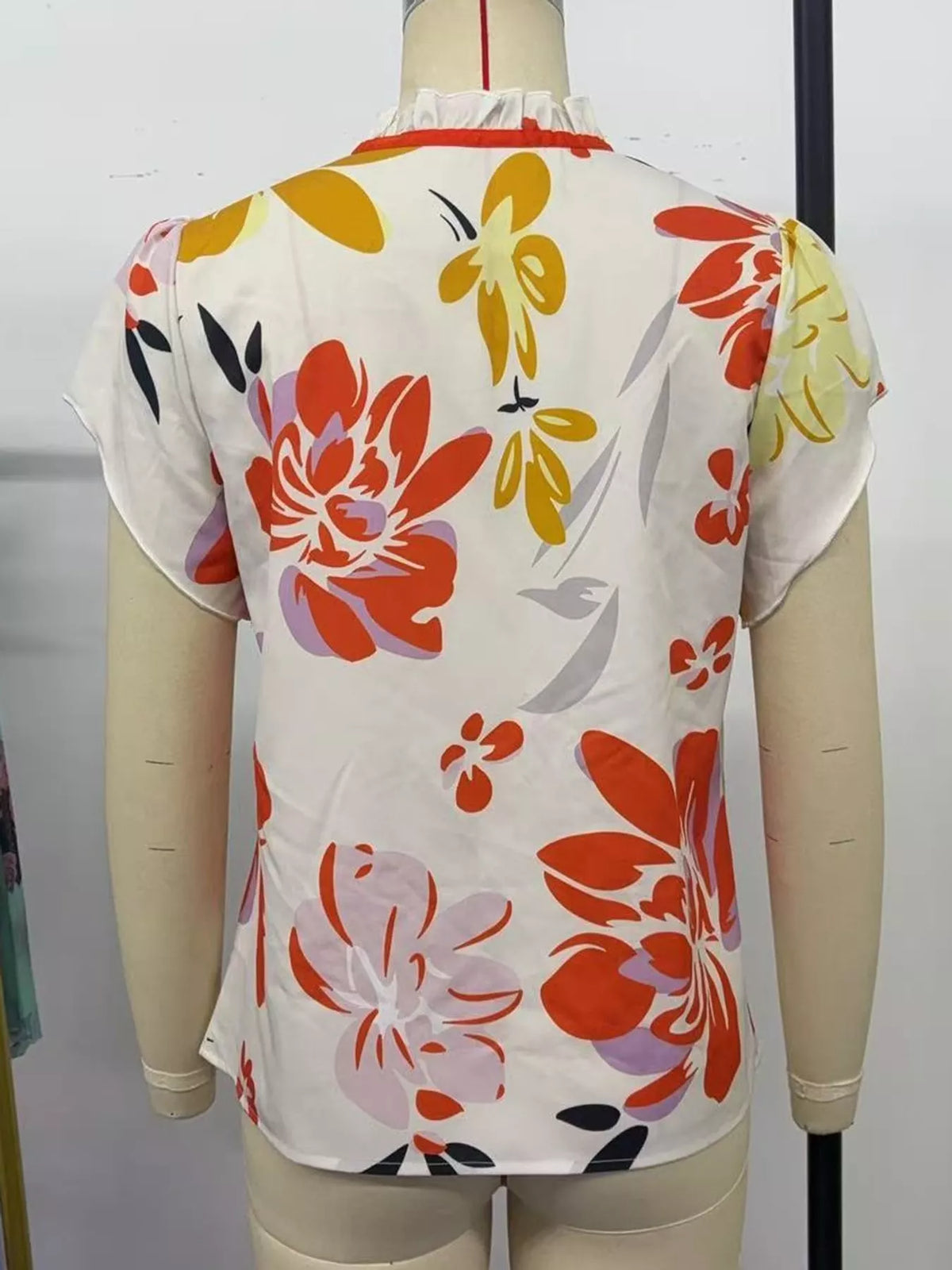 Contrast Trim Ruffle Sleeve Tie-Front Blouse, back view in white with multicolor floral print