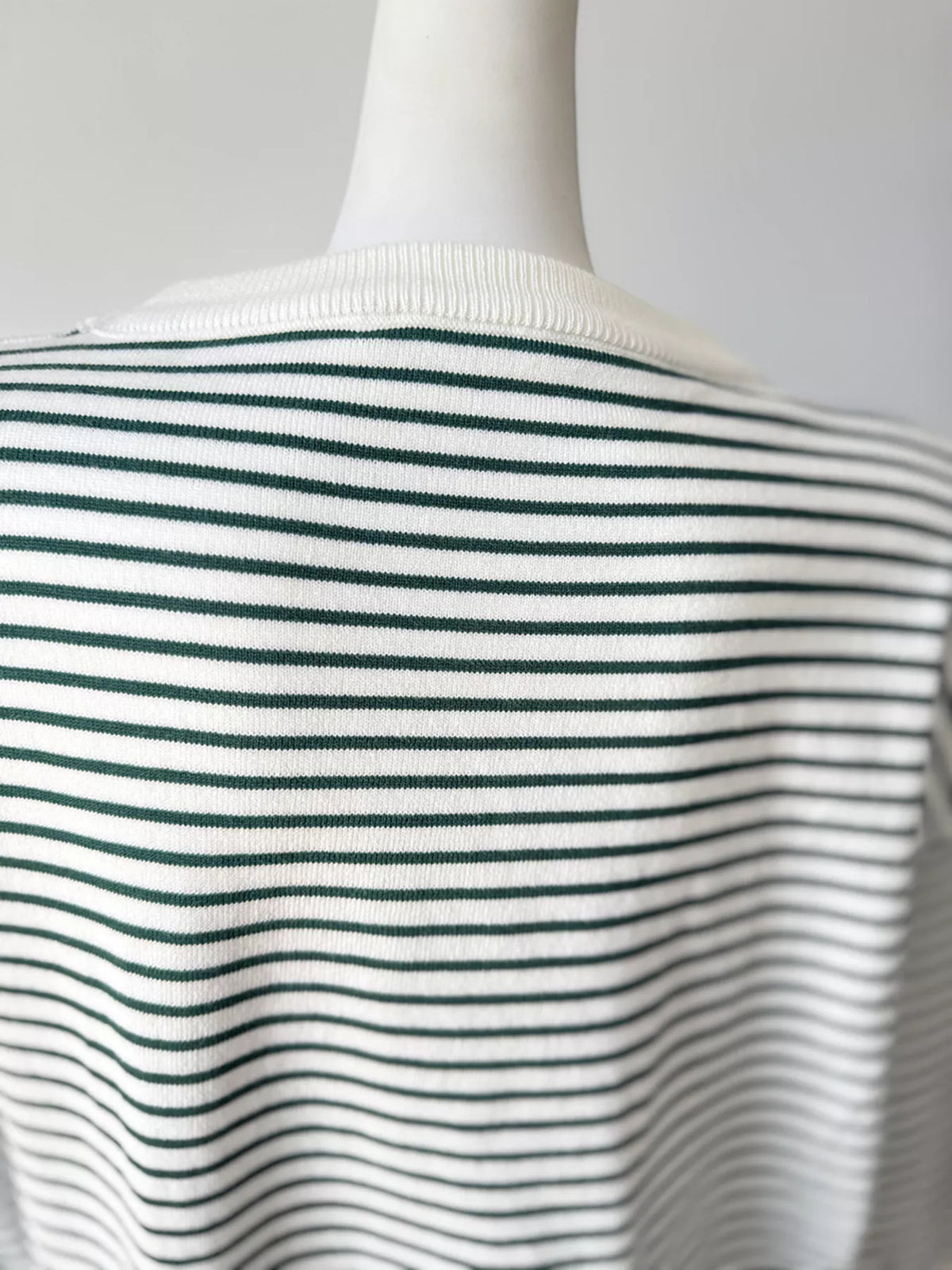 Striped round-neck knit top in white and green, back neckline detail