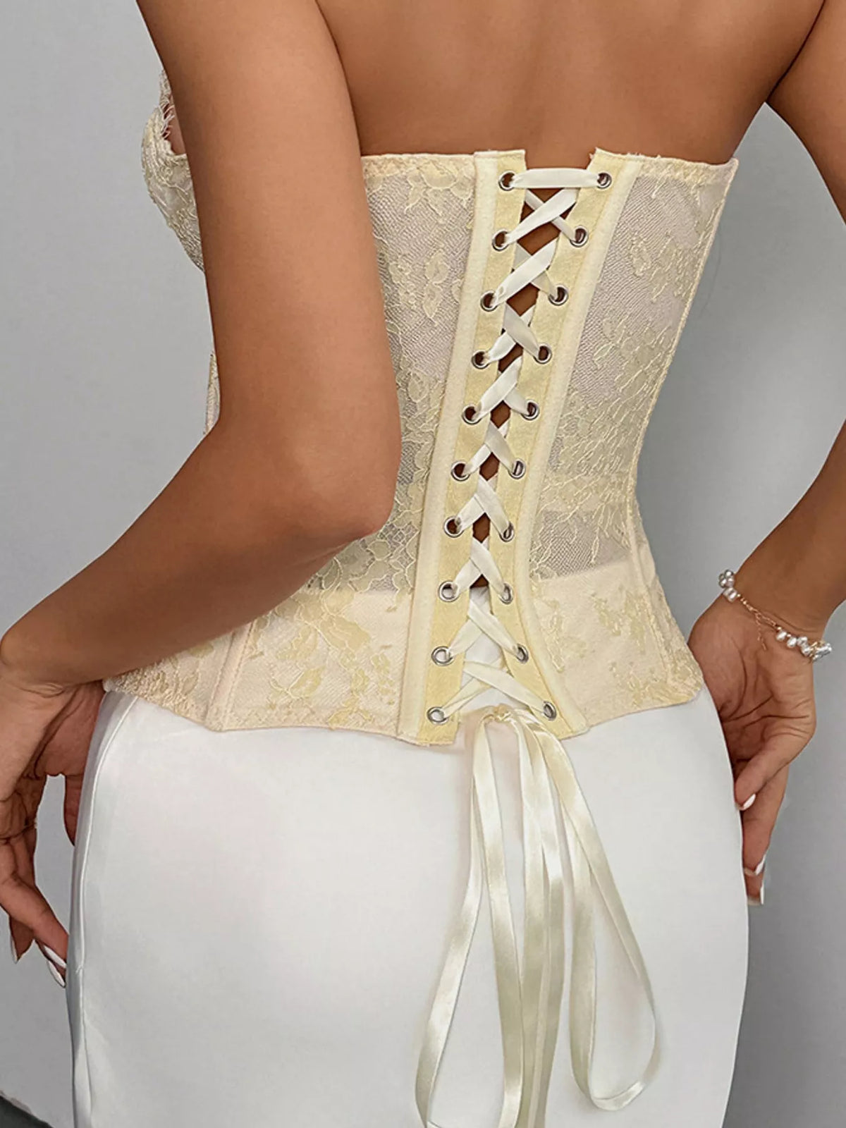 Yellow lace corset tube top, back view