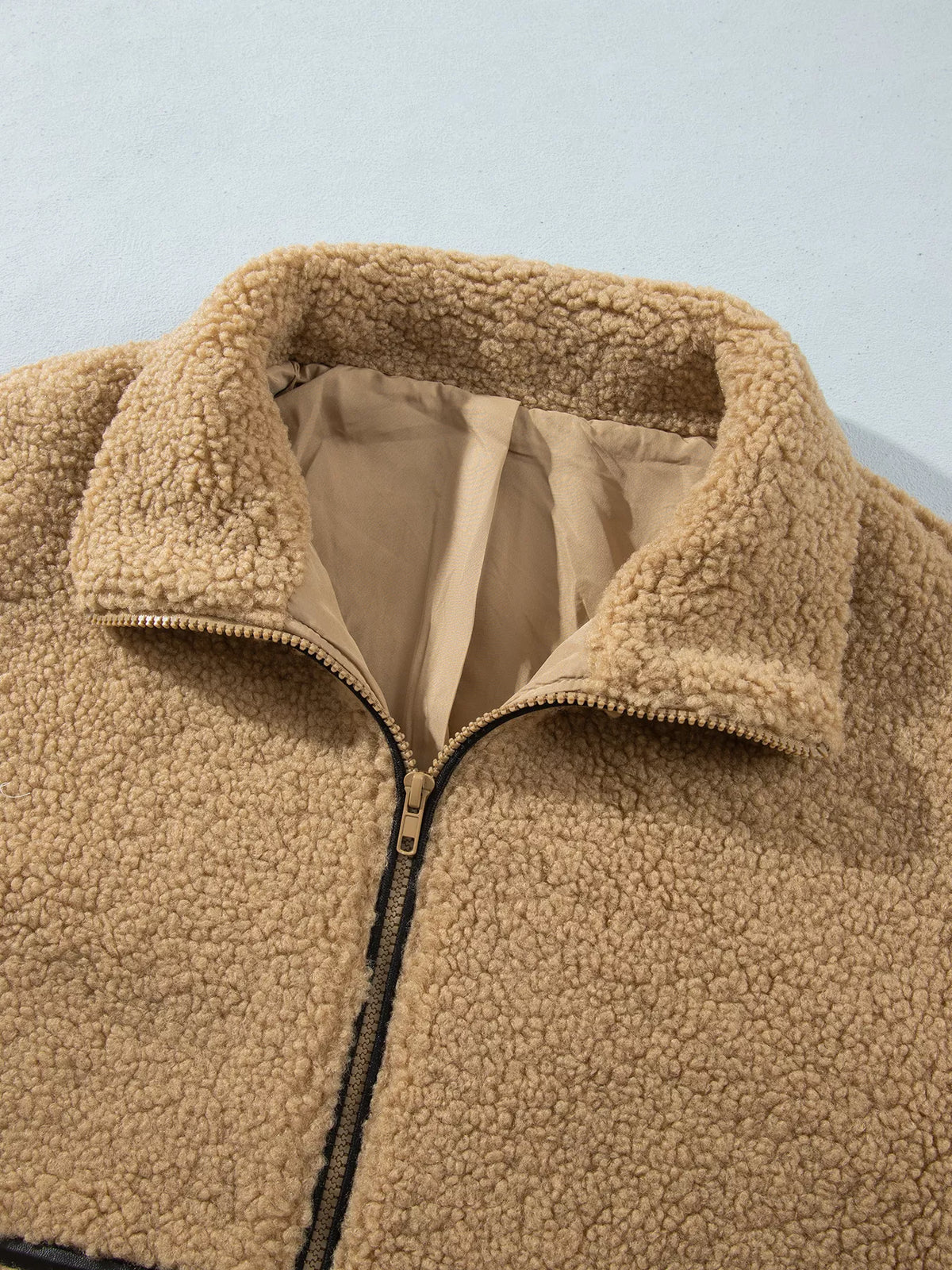 Camel fleece zip-front jacket with contrasting seam trim, collar detail