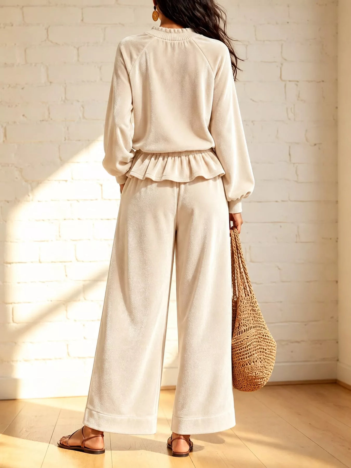 Cream velvet ruffled hem top and wide-leg pants set — back view