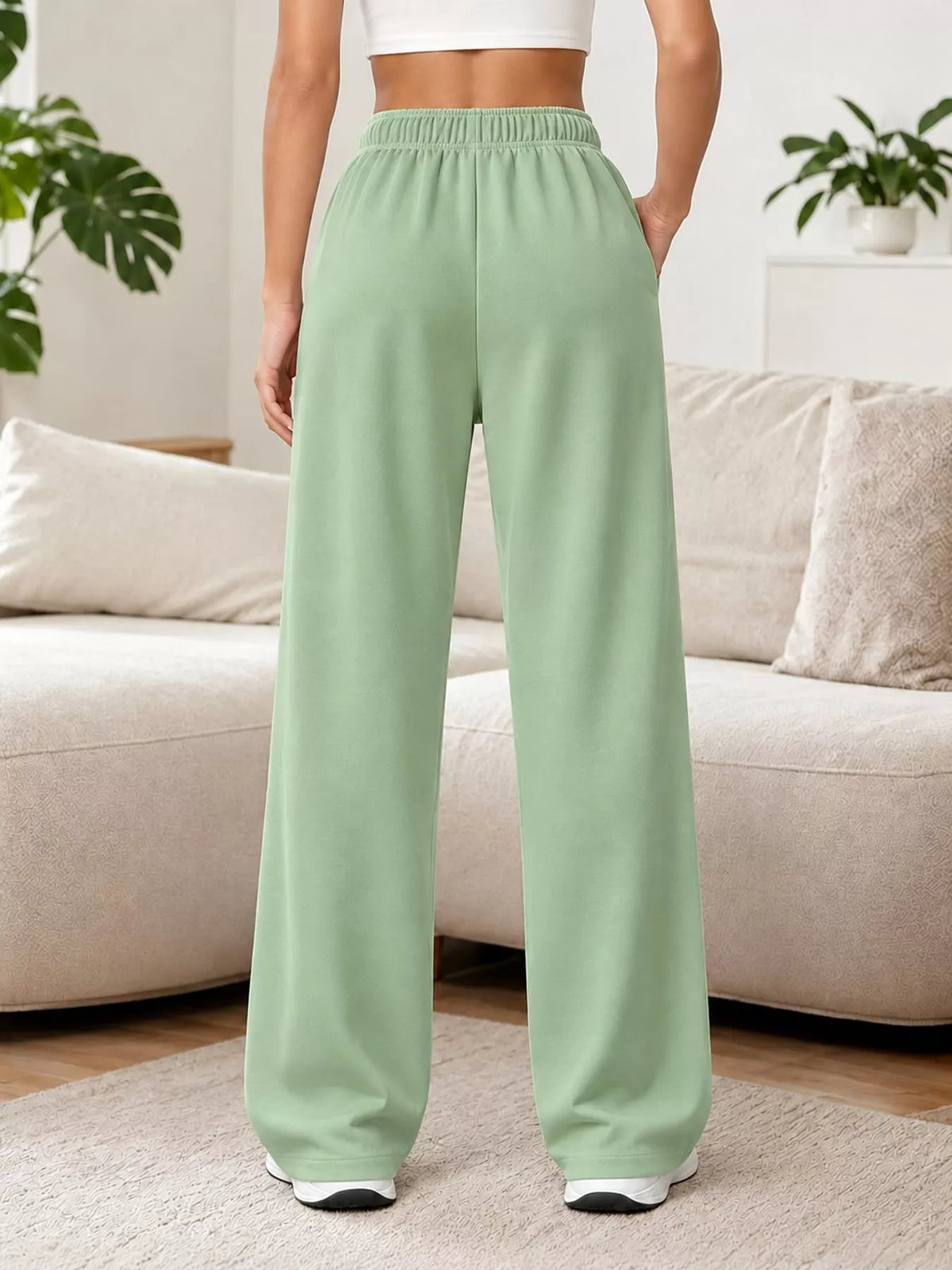 Mint green wide-leg pants with drawstring, back view