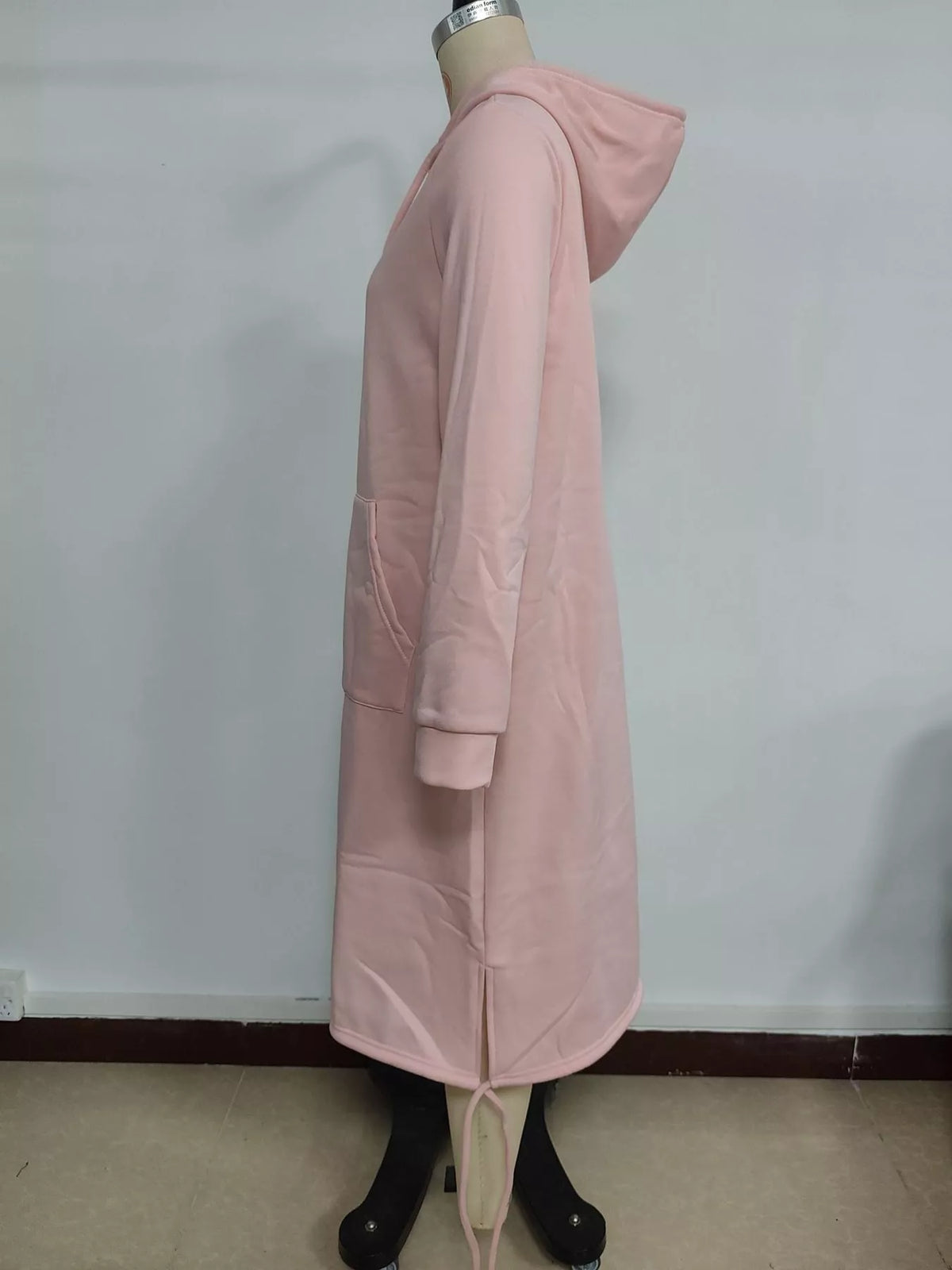 Pink hooded sweatshirt midi dress with drawstring hem, side view