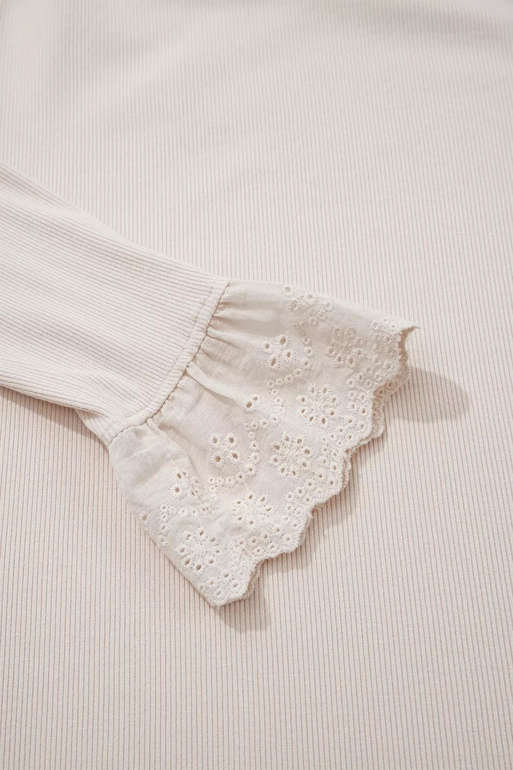 Beige lace-cuff long sleeve top, lace cuff close-up