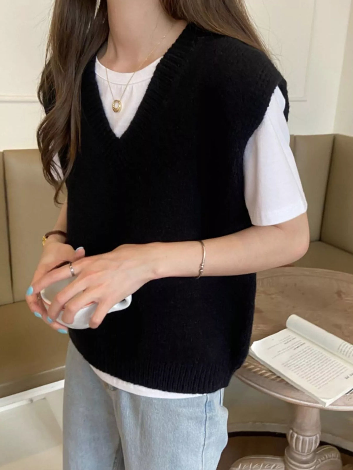 Black v-neck knit sweater vest