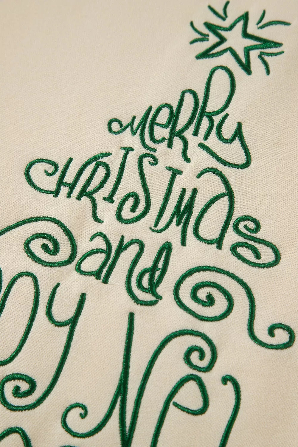 Green holiday lettering on cream christmas tree merry christmas and happy new year sweatshirt