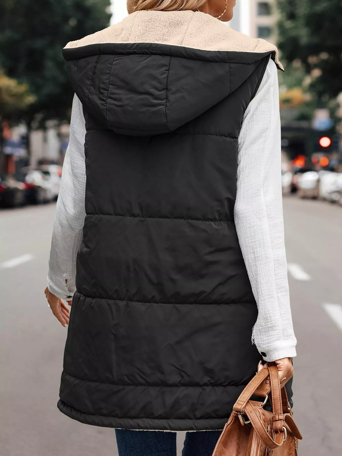 Black hooded sherpa-lined puffer vest, back view