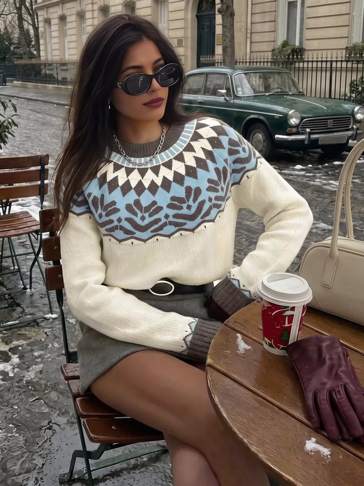 Cream Fair Isle round neck sweater, seated front view