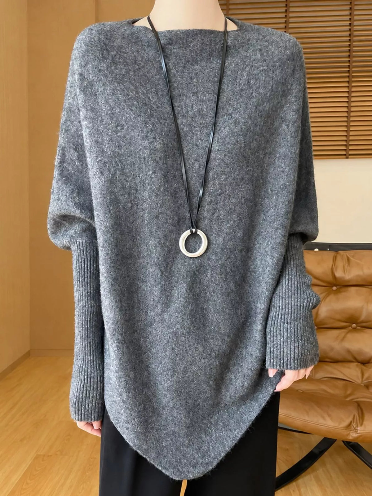 Gray asymmetrical lantern sleeve sweater — front view