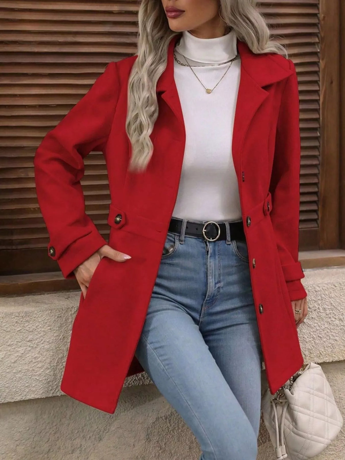 Red single-breasted coat, open front view with hand at hip