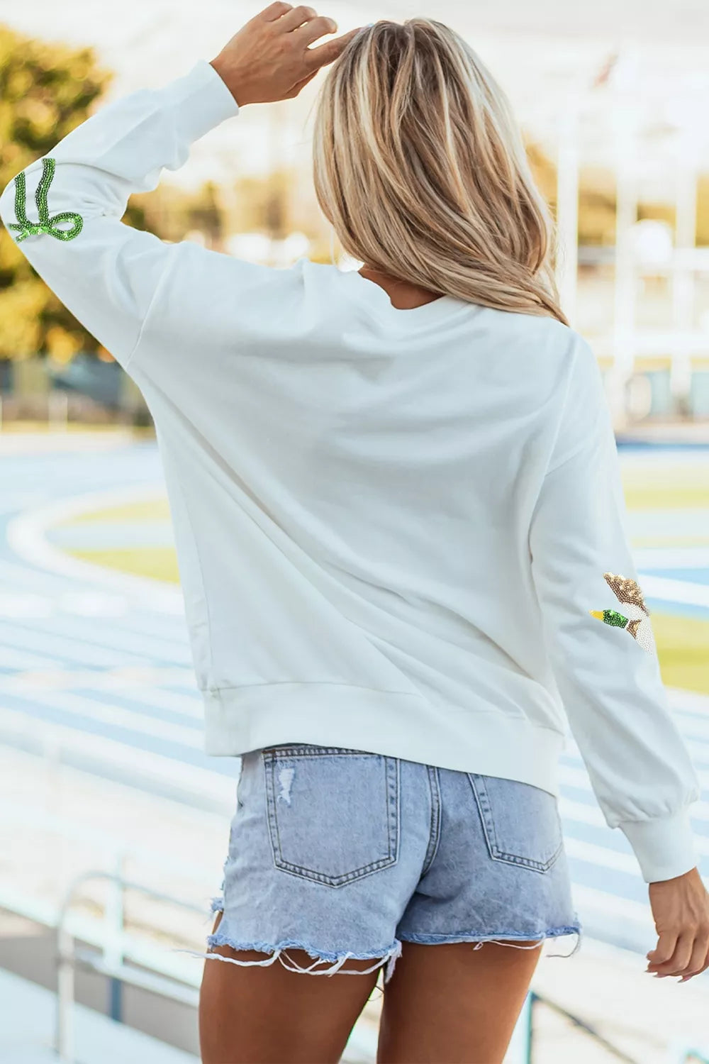White mallard and bow sequin sweatshirt, back view