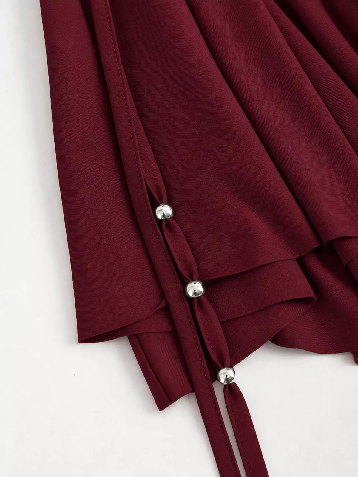 Ruched Asymmetrical Drawstring Mini Skirt, detail view in burgundy