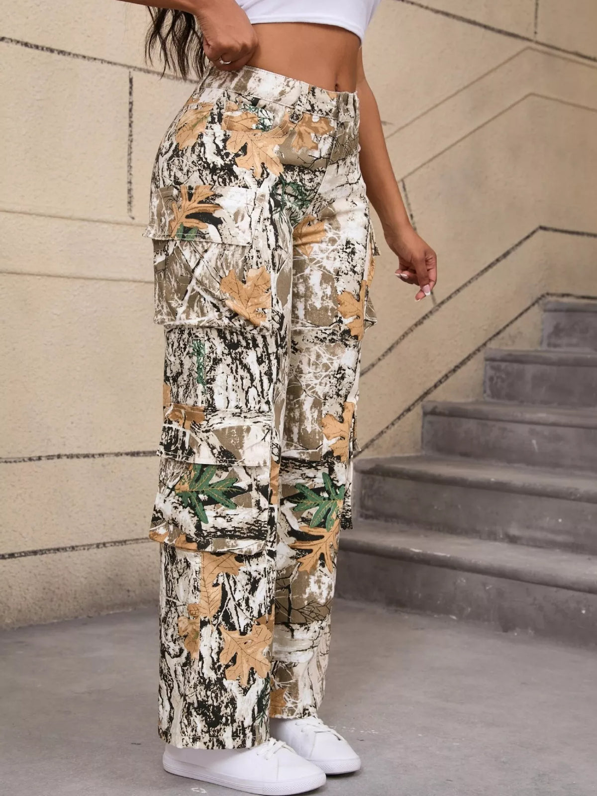 Beige and green high-waisted camouflage cargo pants, side showing flap pocket.