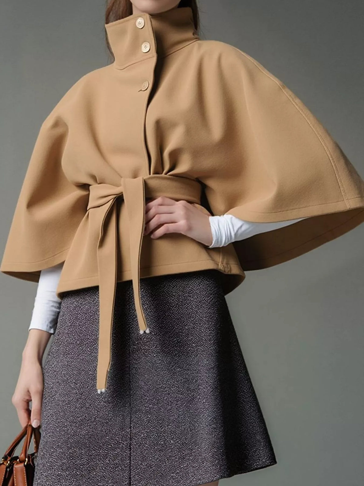 Tan belted button-front cape — front view