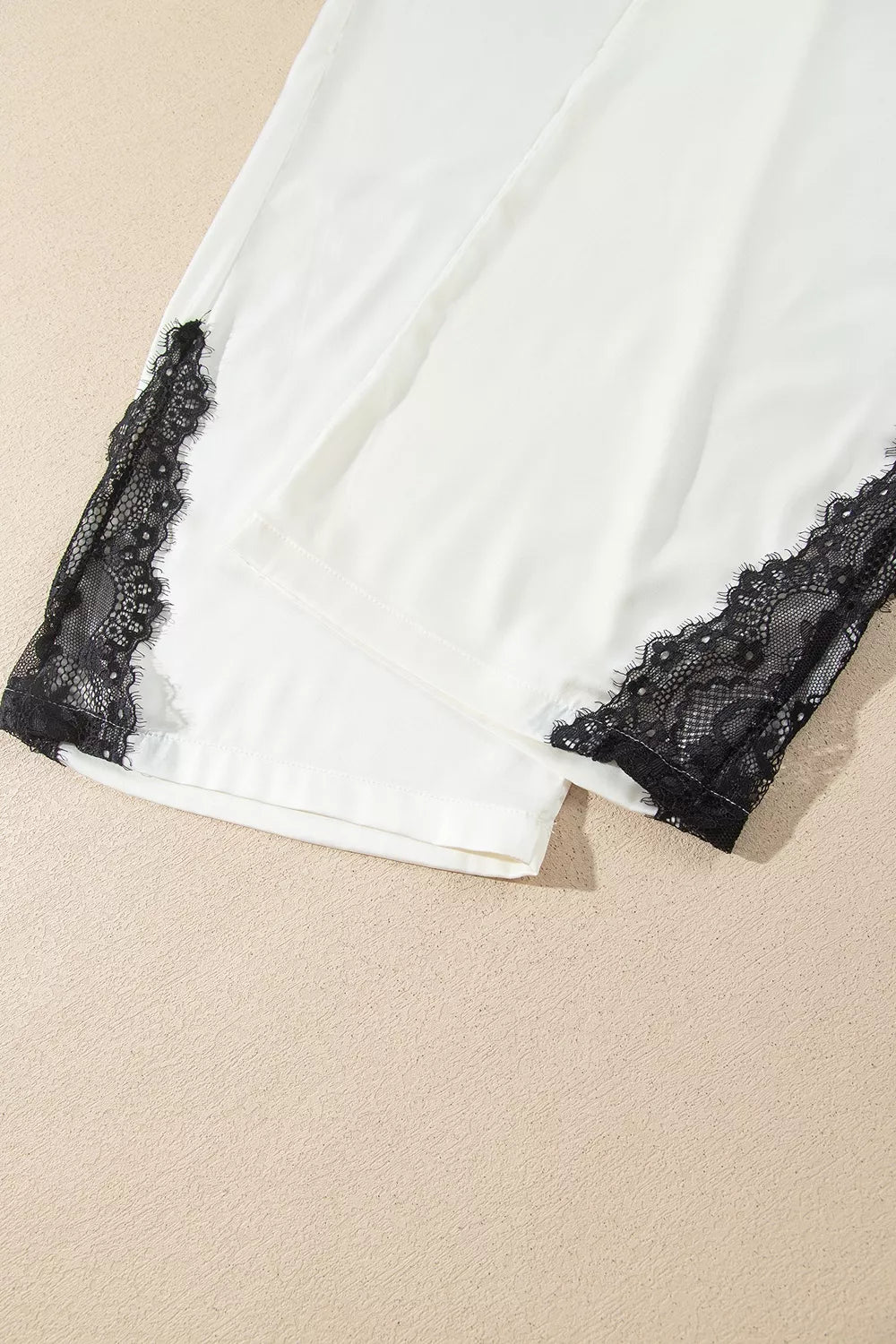 Ivory lace-trim button-front pajama set, pant hem lace detail.