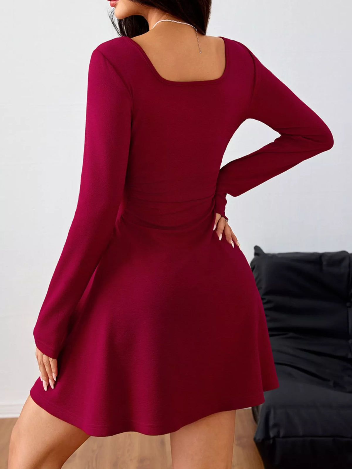Burgundy square-neck ruched-waist mini dress, back view.