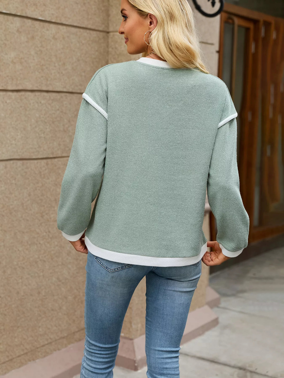 Sage green contrast-trim V-neck sweater, back view