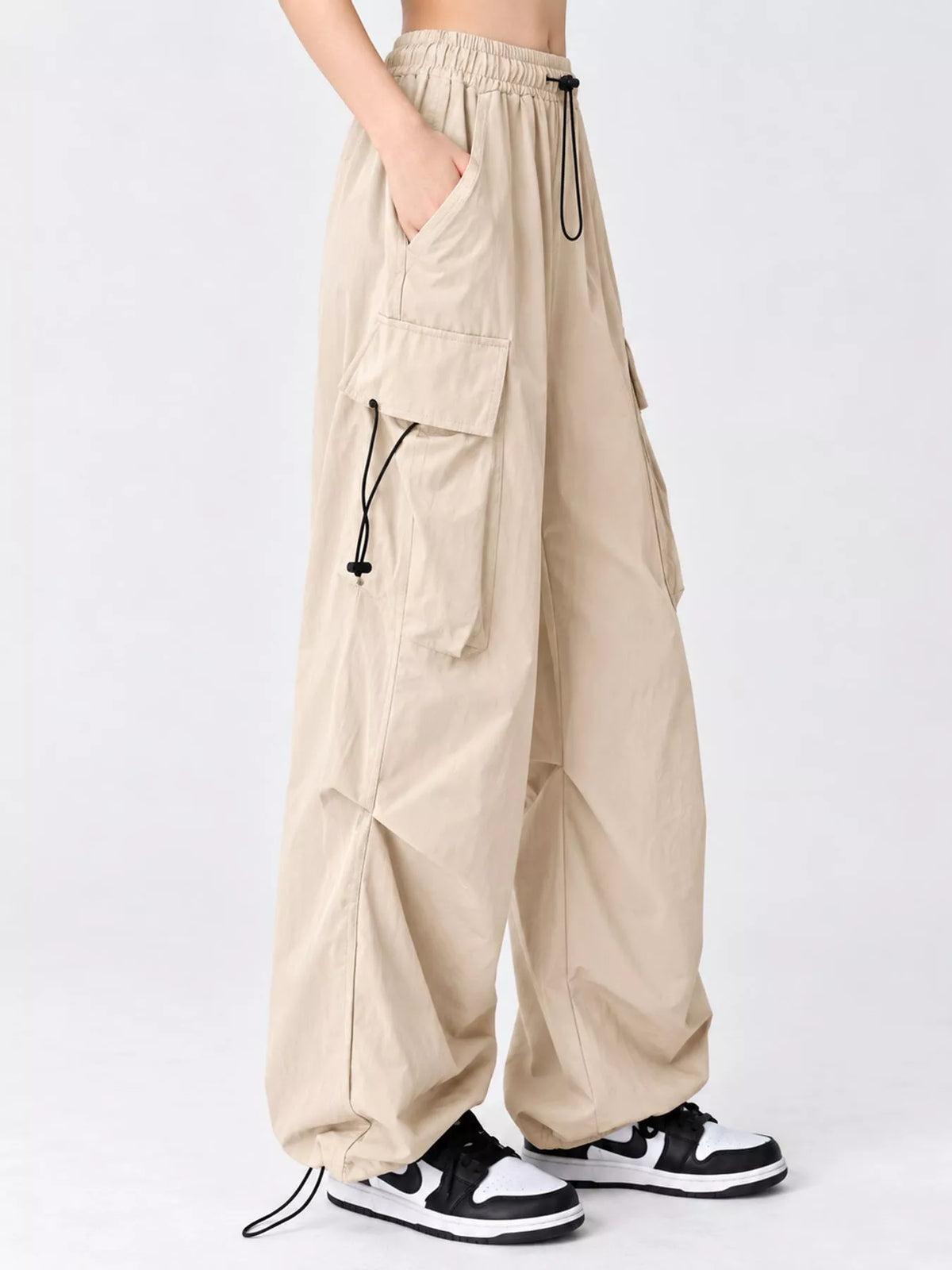 Beige drawstring cargo pants, side view