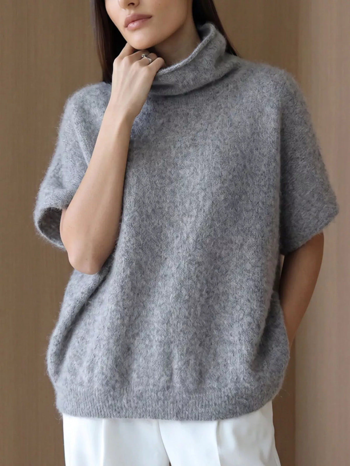 Fuzzy short-sleeve turtleneck sweater in gray, neckline view on model