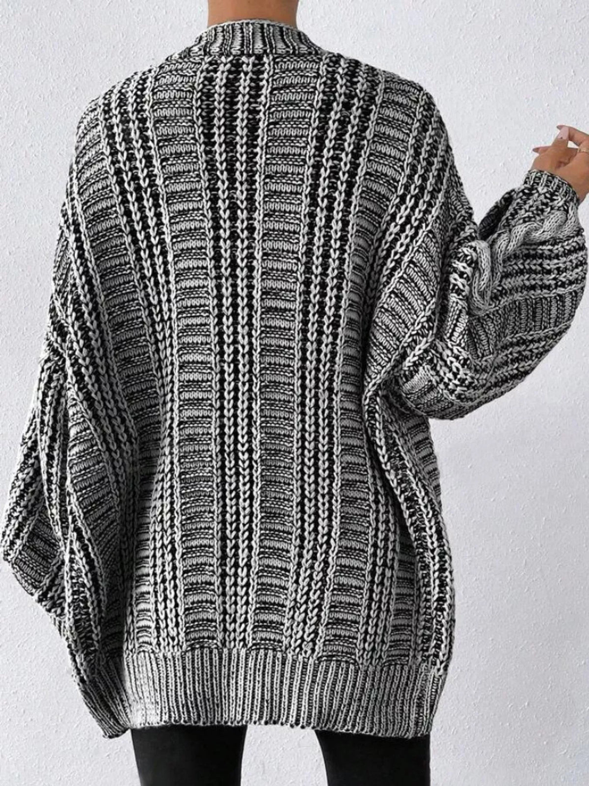 Gray chunky cable knit button down cardigan, back view