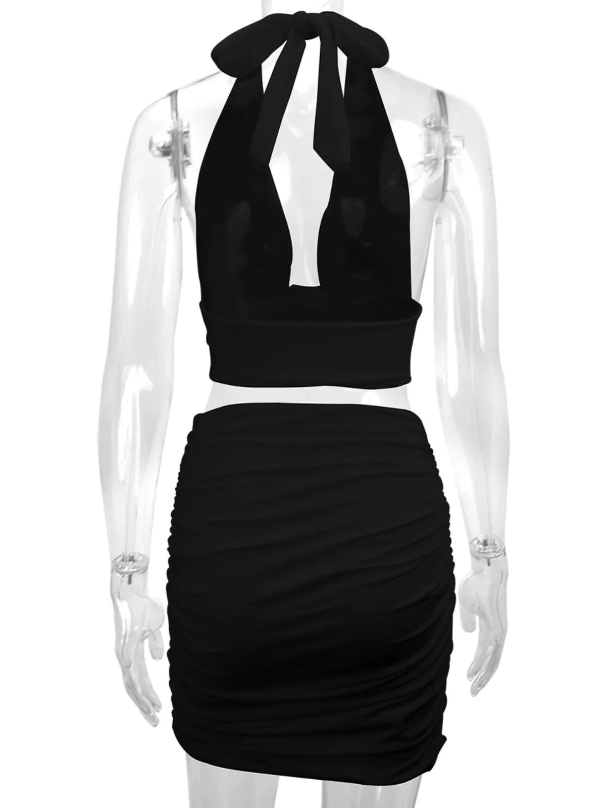Black halter crop top and ruched bodycon mini skirt set, back view
