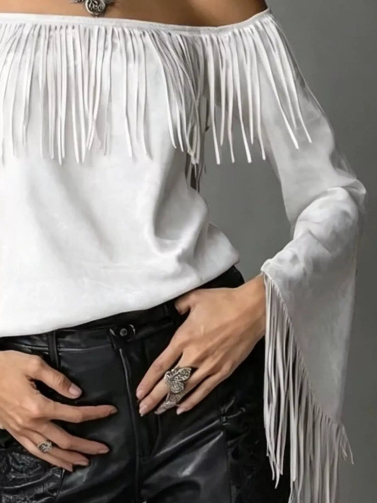 Off-shoulder faux suede fringe top in white, neckline and cuff fringe detail