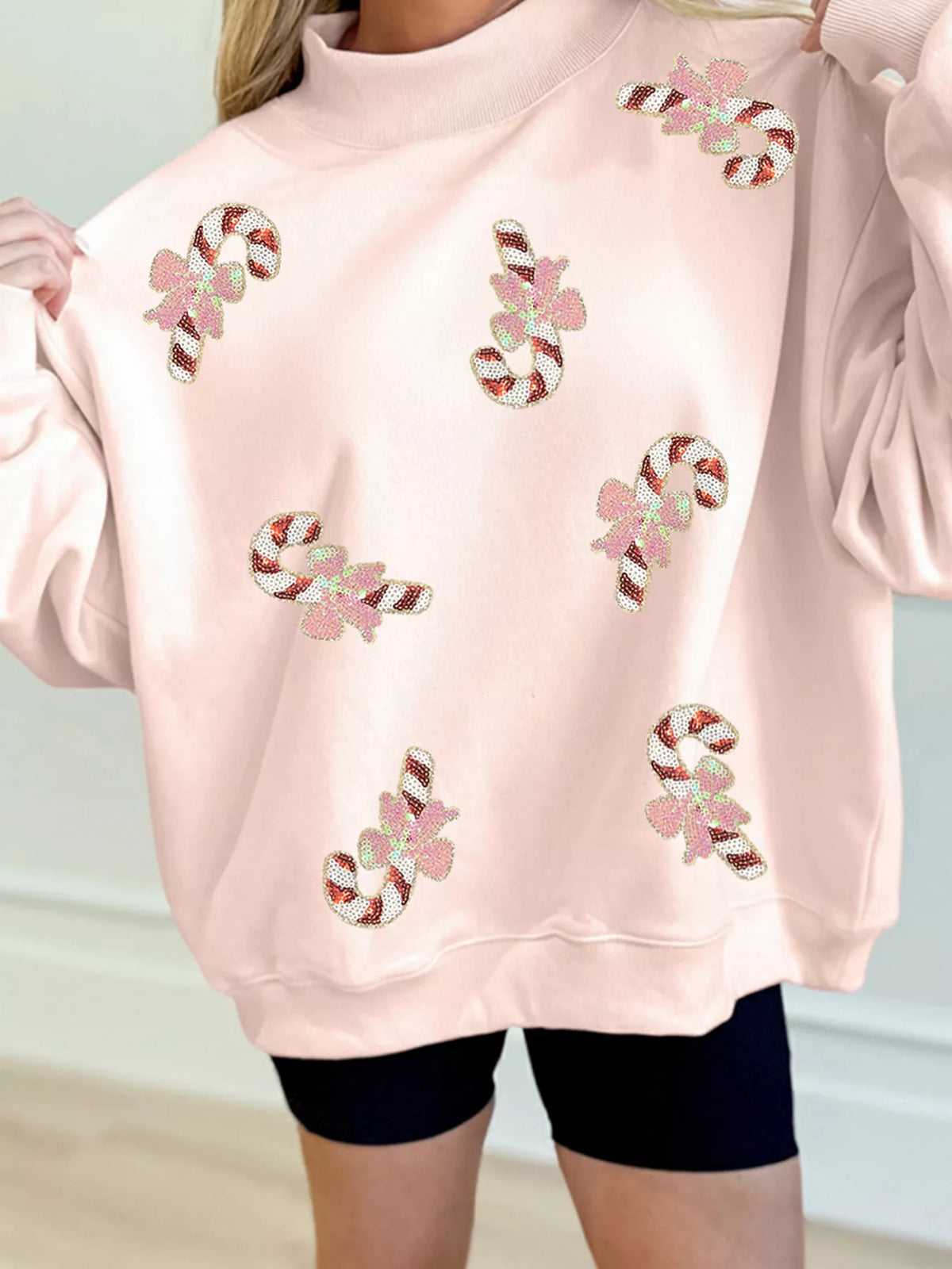 Sequin candy-cane sweatshirt, pink sequin front held out