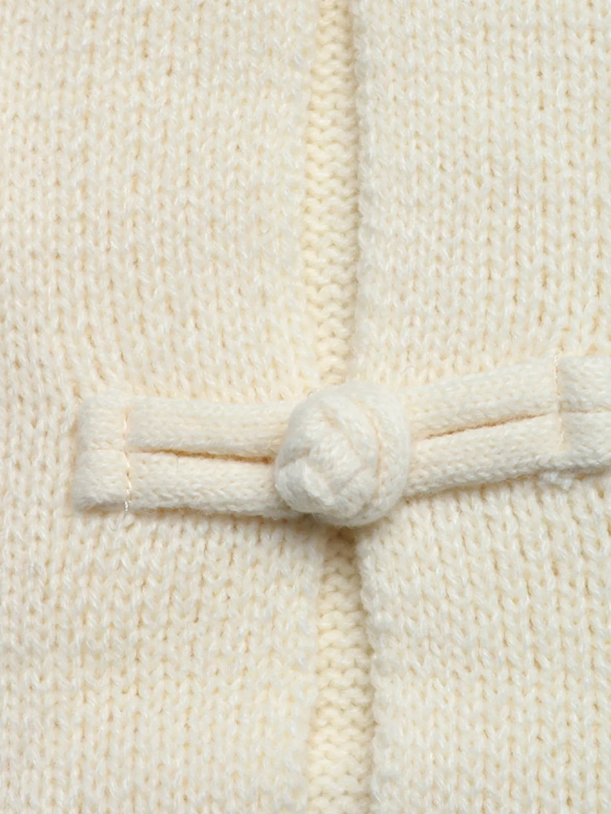 Cream Chinese knot button cardigan with sleeve stripes, knot button close-up