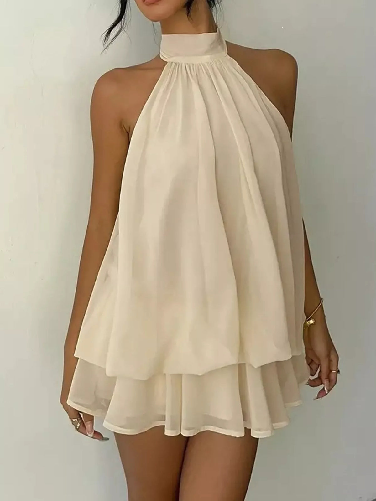 Cream halter neck layered mini dress, layered skirt view