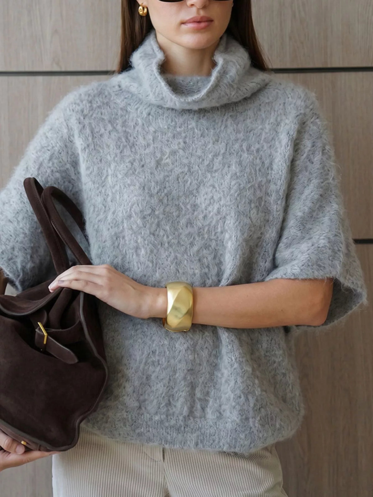 Fuzzy short-sleeve turtleneck sweater in gray, crossed-arm front view