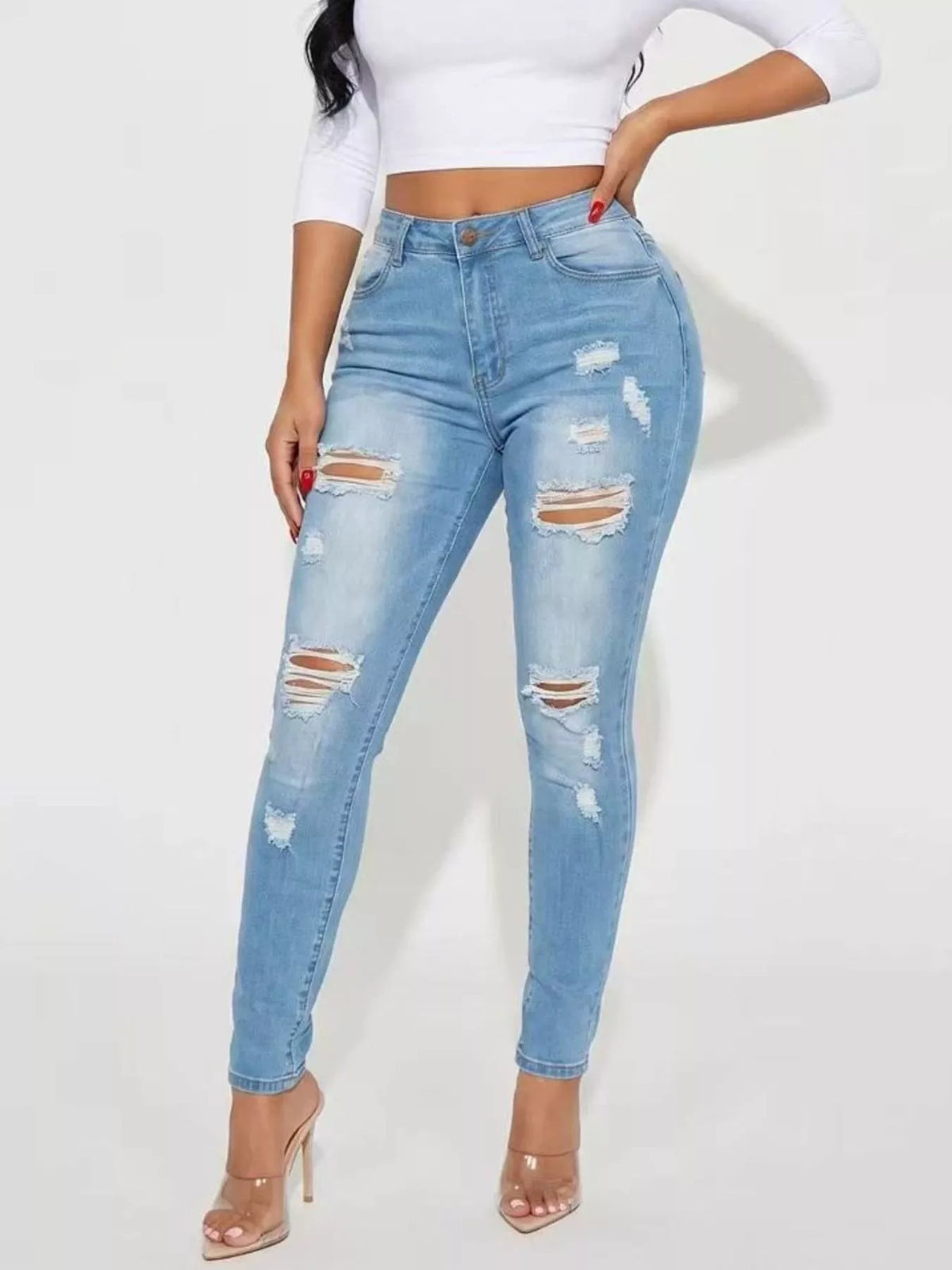 High-Waisted Distressed Skinny Jeans in light blue, front view