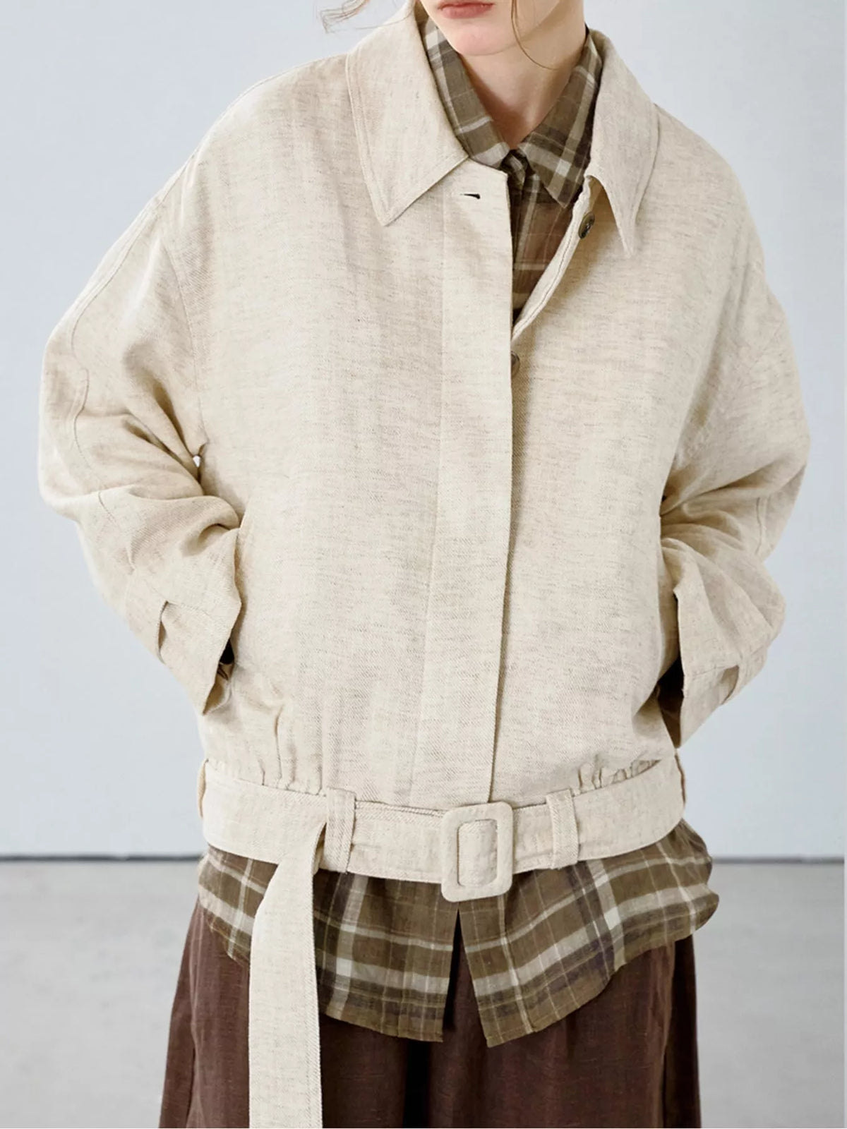 Cream belted dropped shoulder jacket — front view