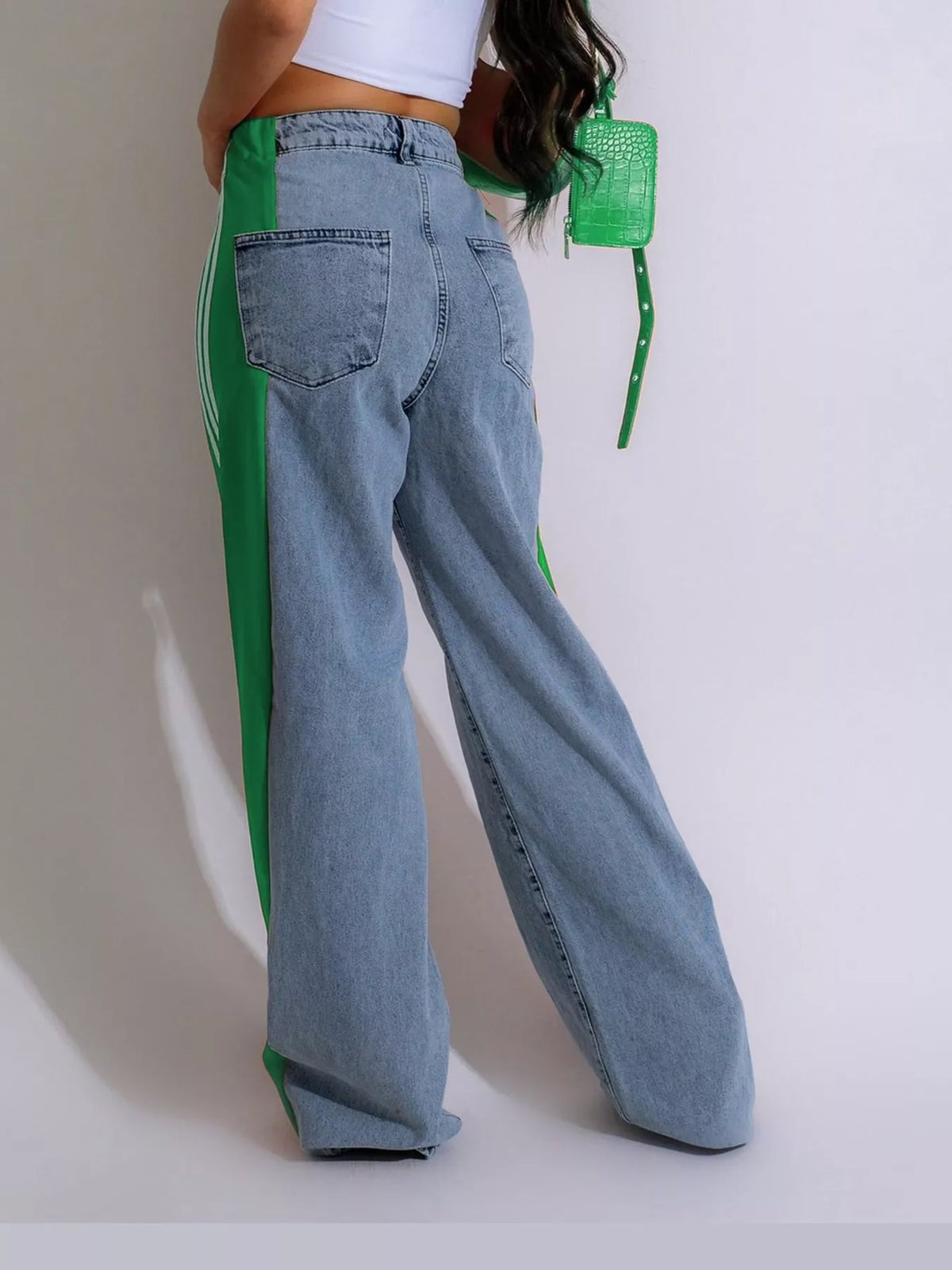 Green high-waisted wide-leg jeans with side stripe detail, back view