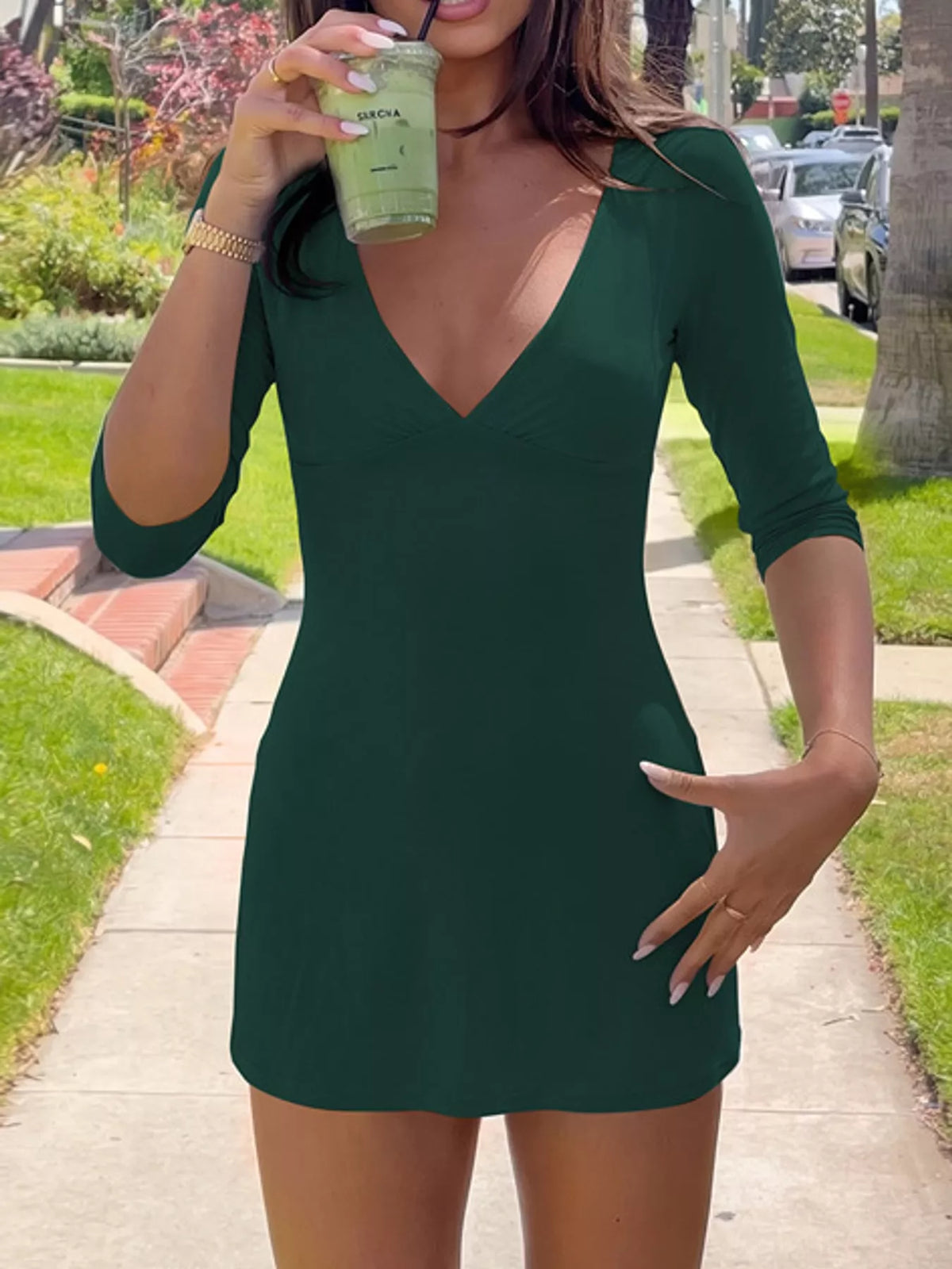 Plunging neck 3/4 sleeve mini dress, front view on model