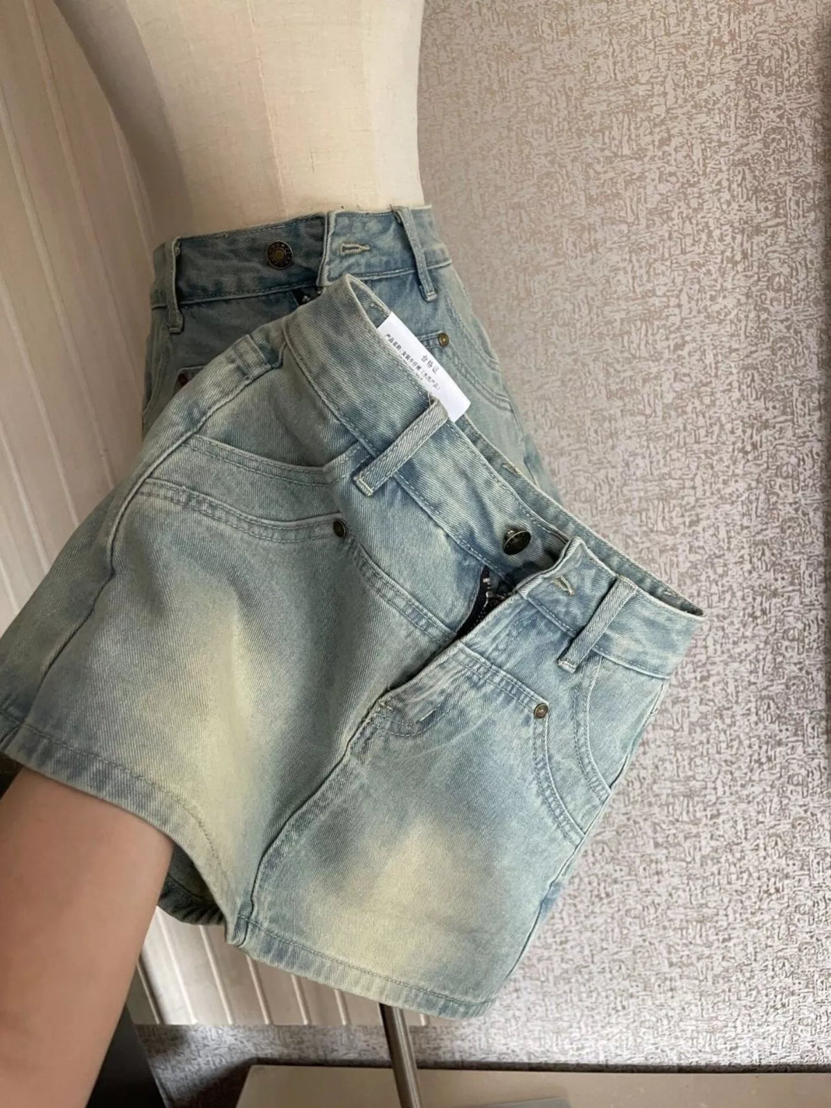 Denim shorts, blue denim shorts angled view