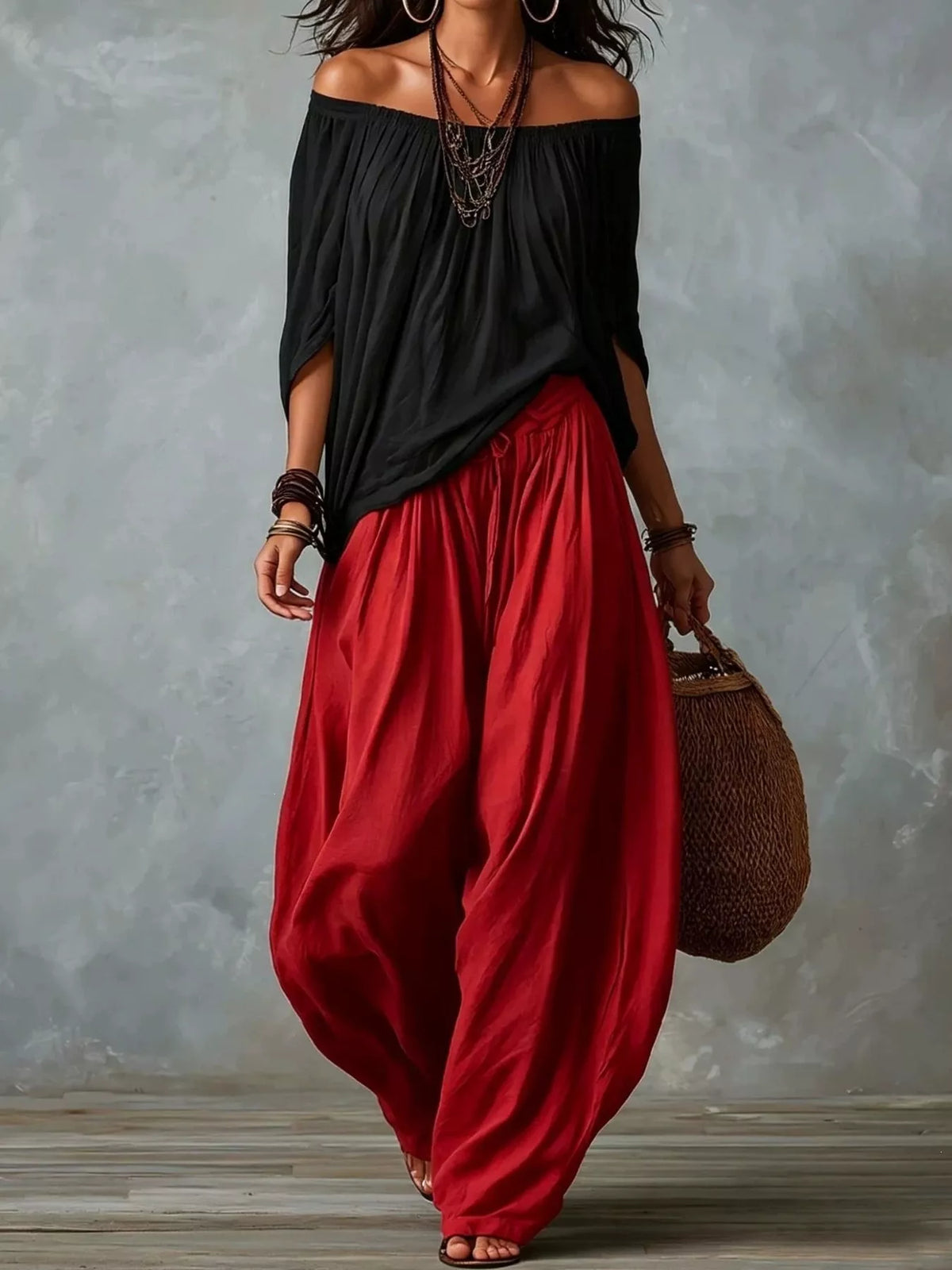 Black top and red pants off-shoulder top and wide-leg harem pants set — front view