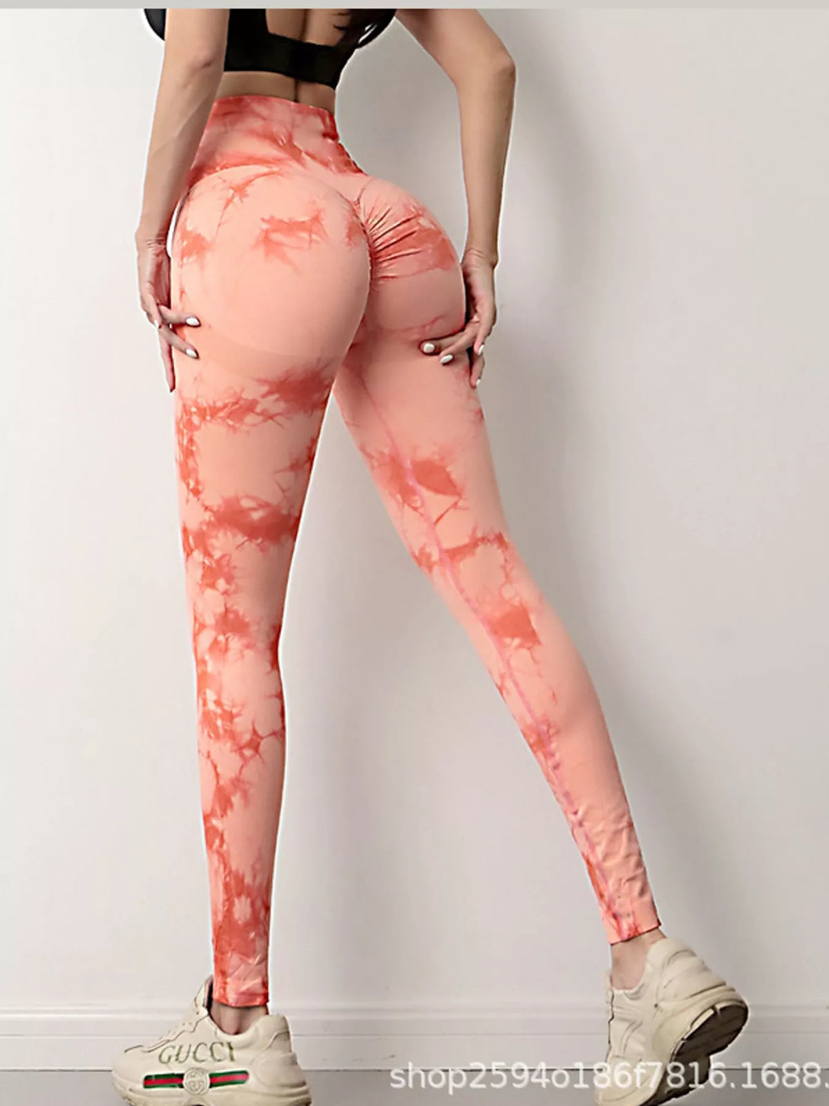 Orange high-waisted tie dye seamless active leggings, back view