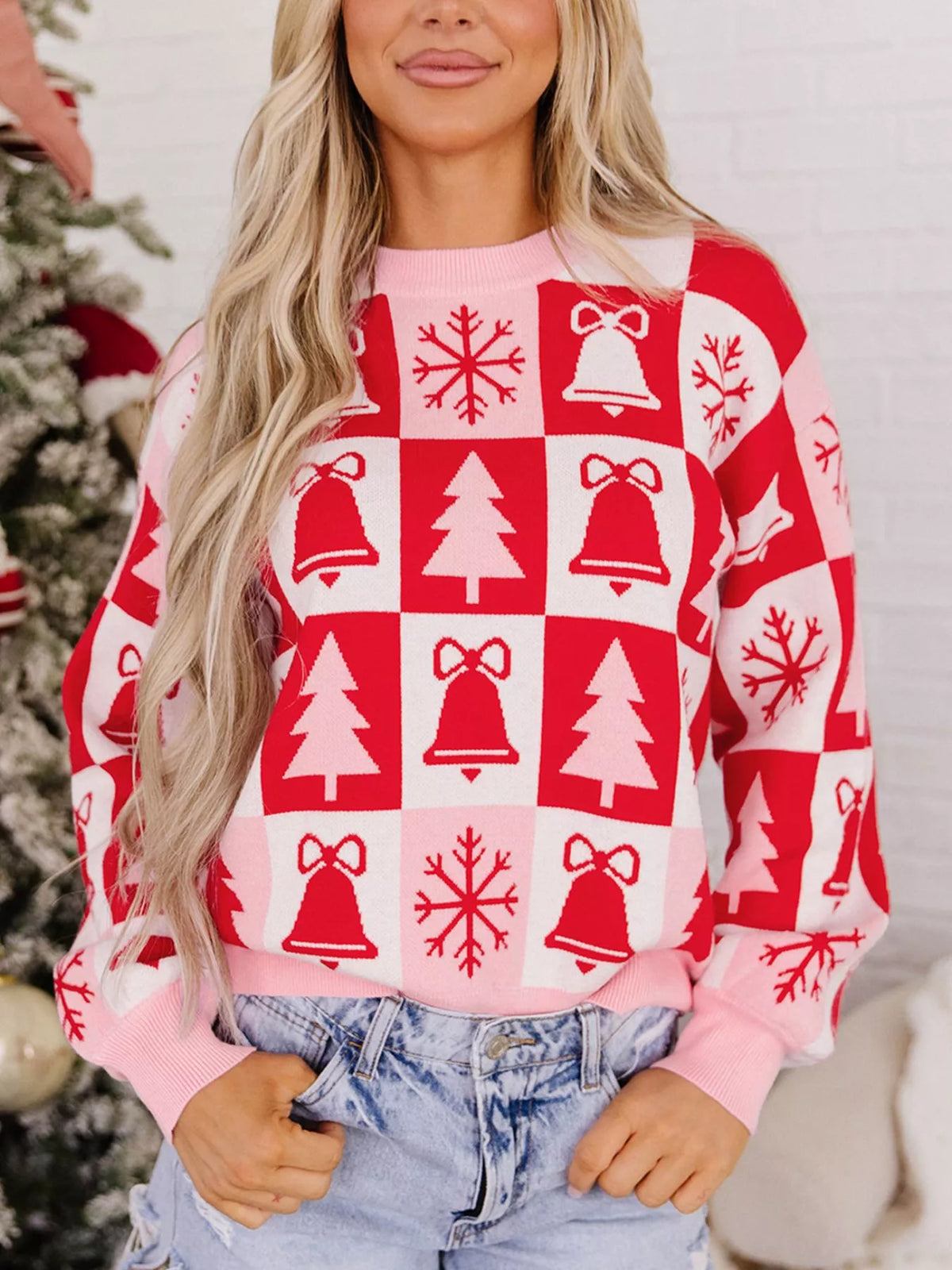 Pink and red Christmas patchwork round neck sweater — front view