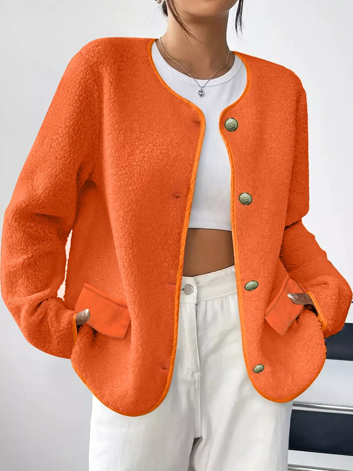 Orange textured button-front jacket — front view