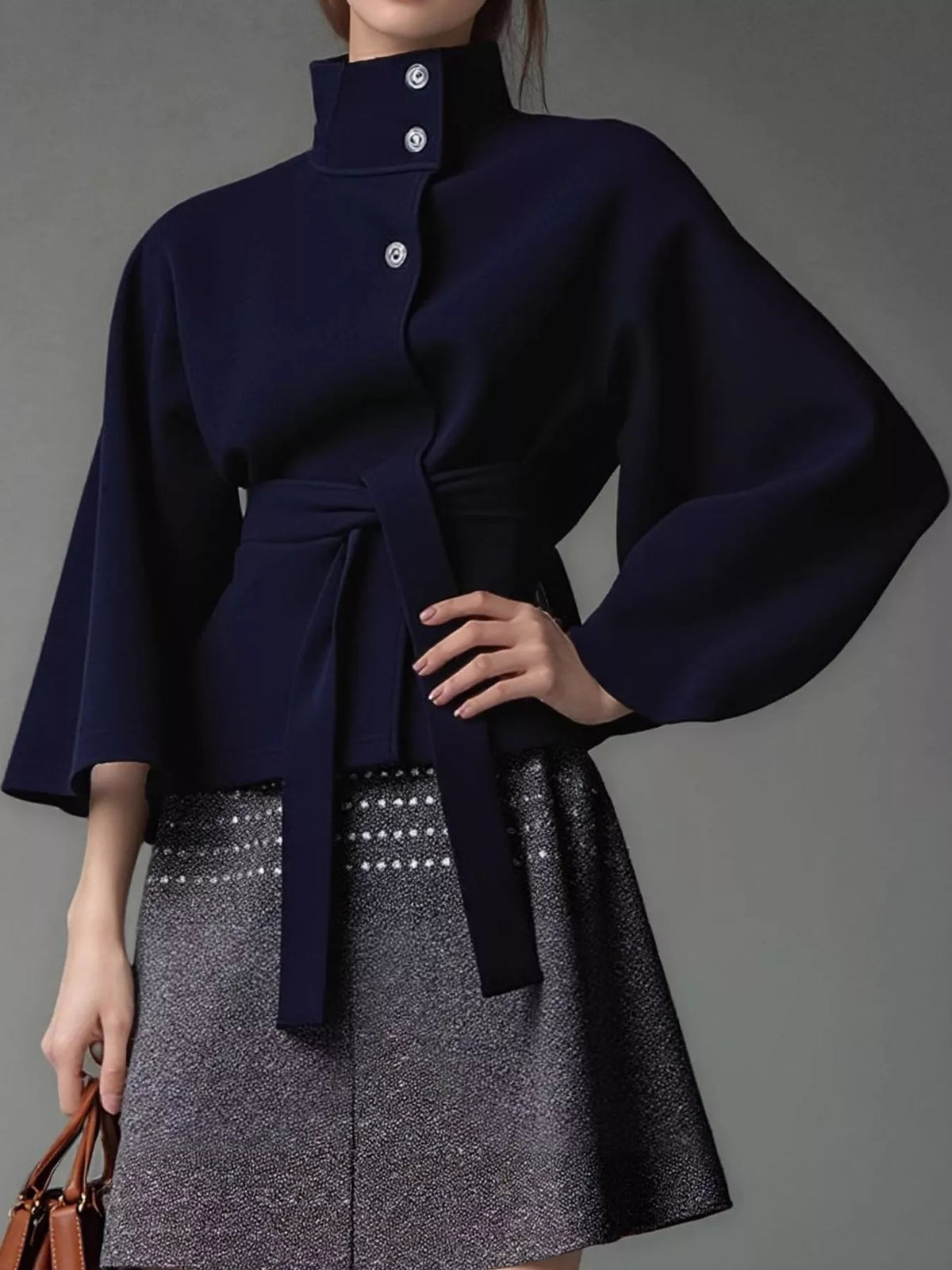 Navy belted button-front cape — front view