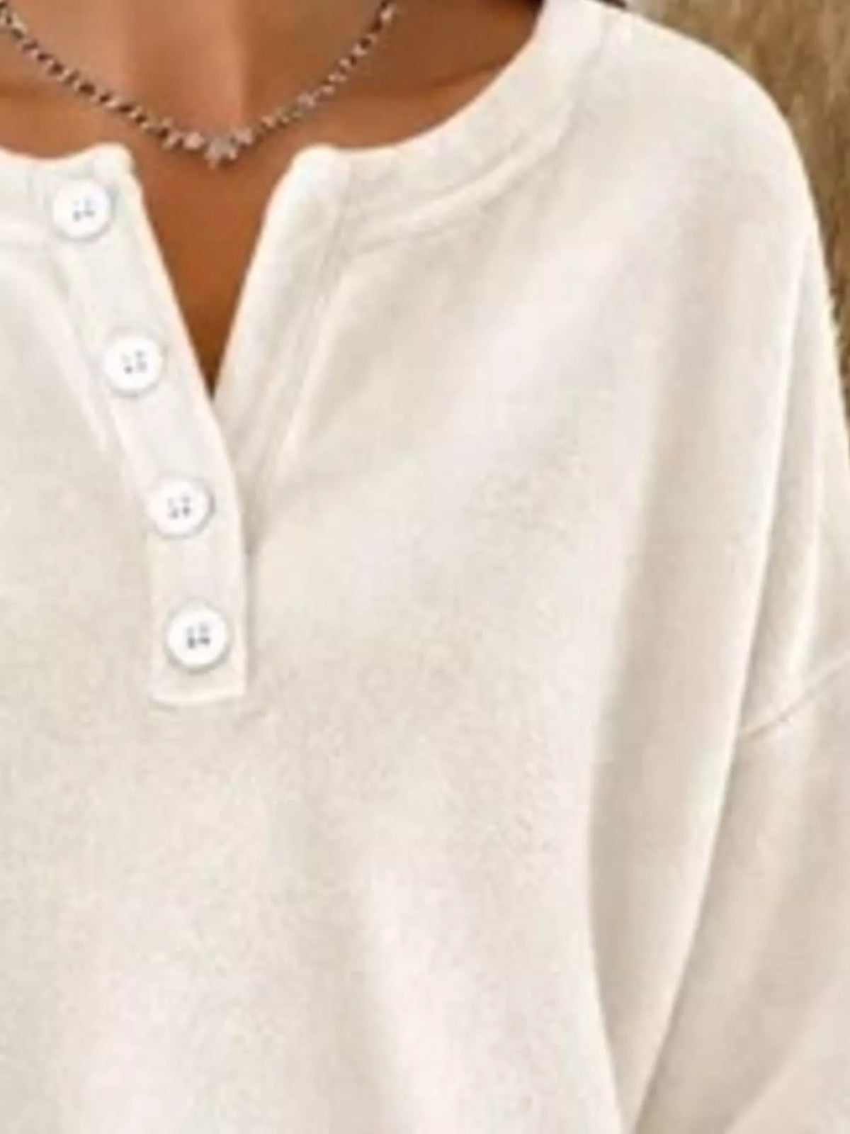 Cream button-detail dropped shoulder sweatshirt, button placket detail