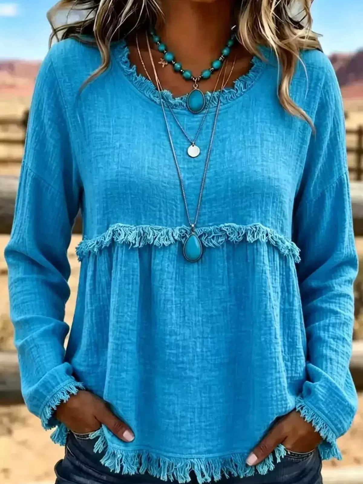 Turquoise frayed hem textured blouse, front view