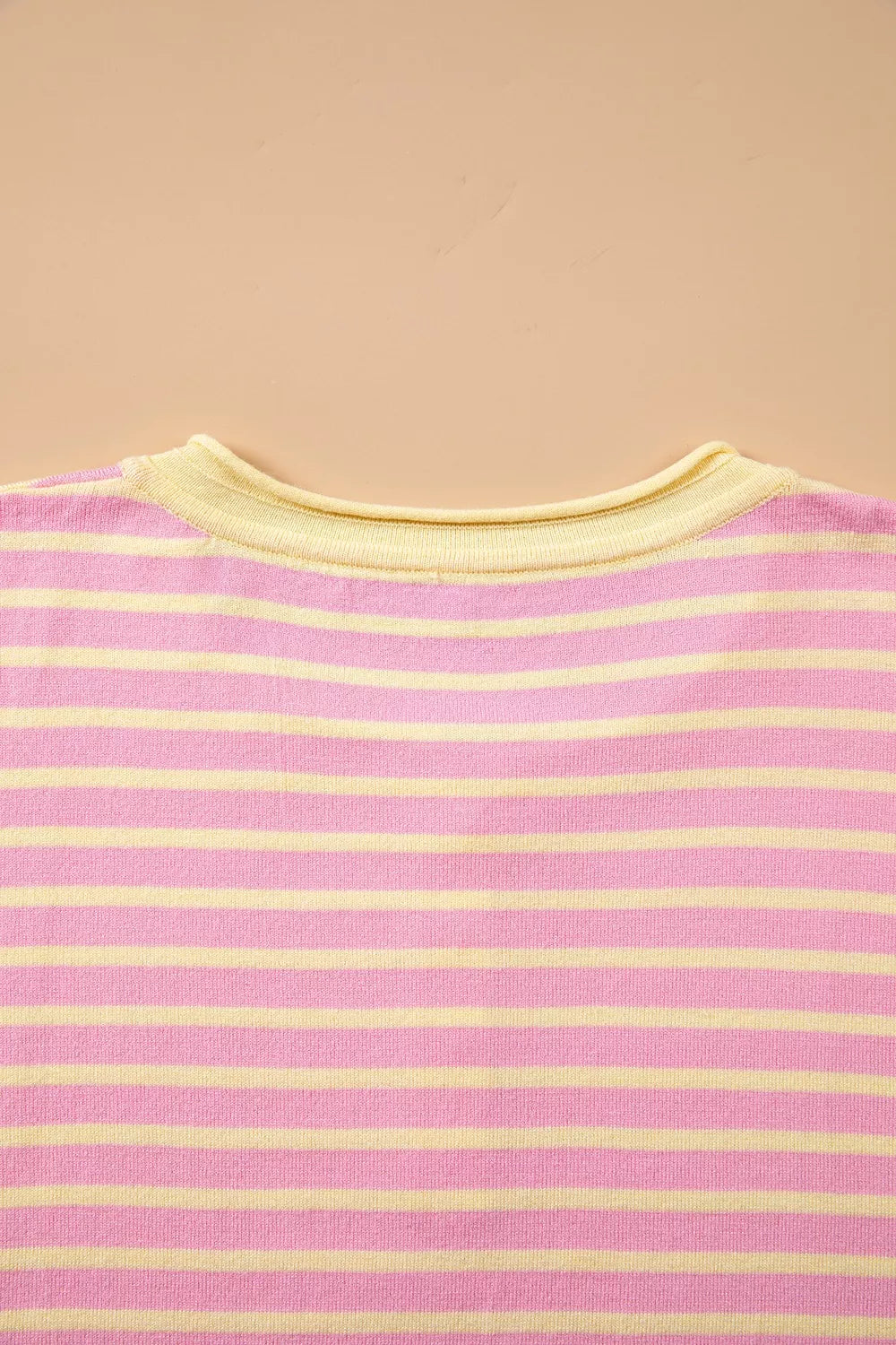 Pink and yellow striped button-detail sweater, back neckline detail
