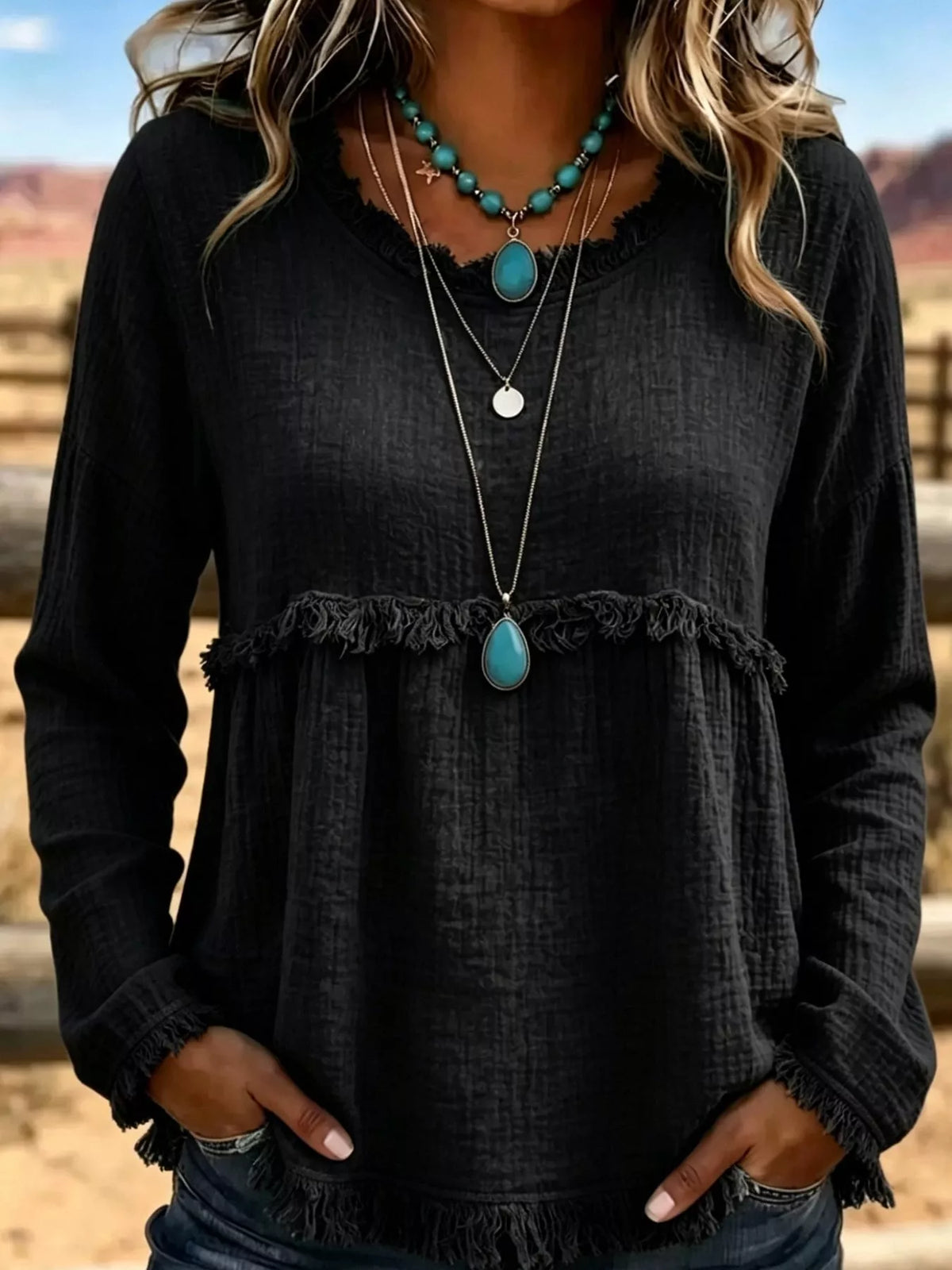 Black frayed hem textured blouse, front view