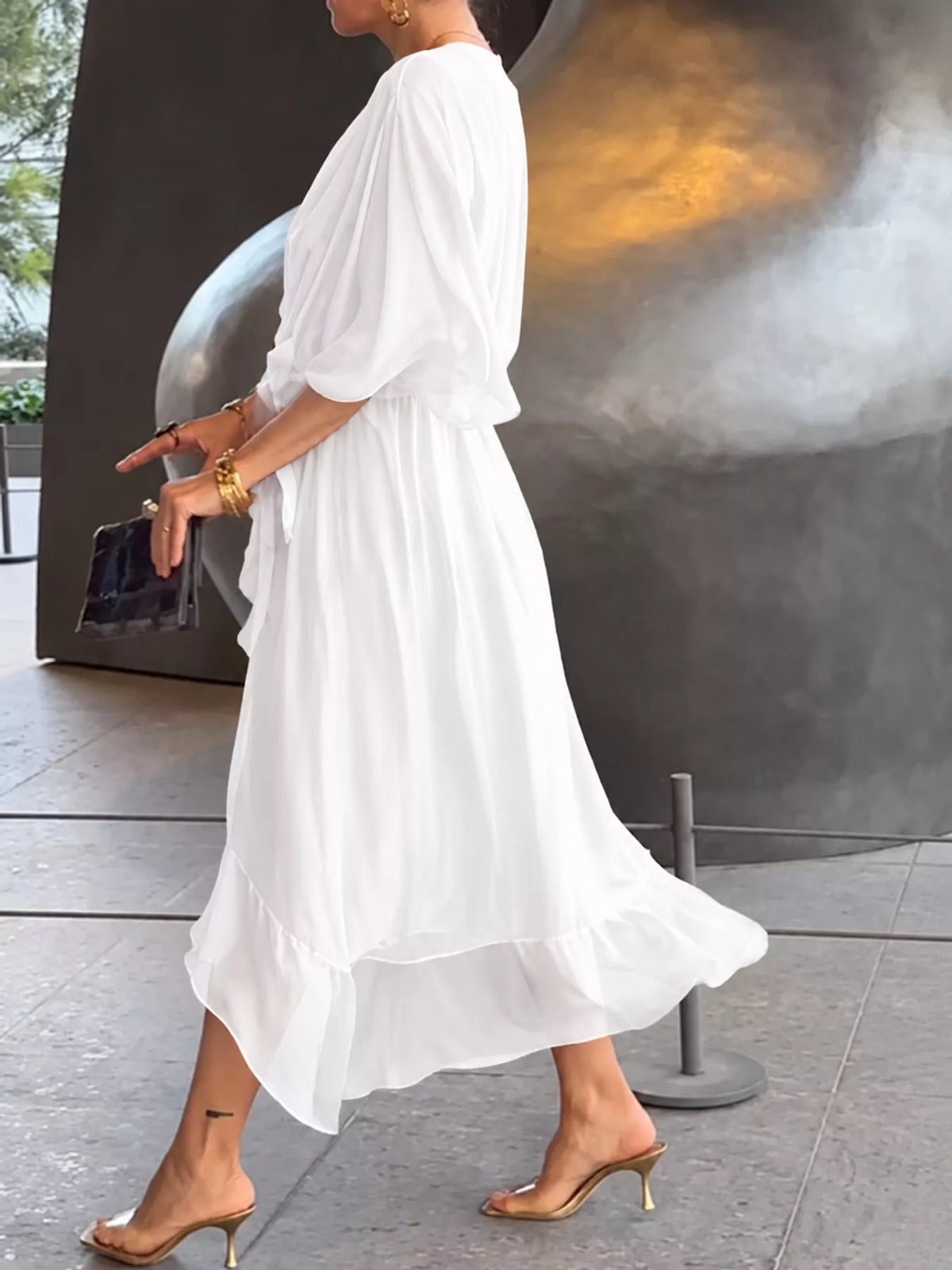 White batwing sleeve wrap dress with waist tie, side view