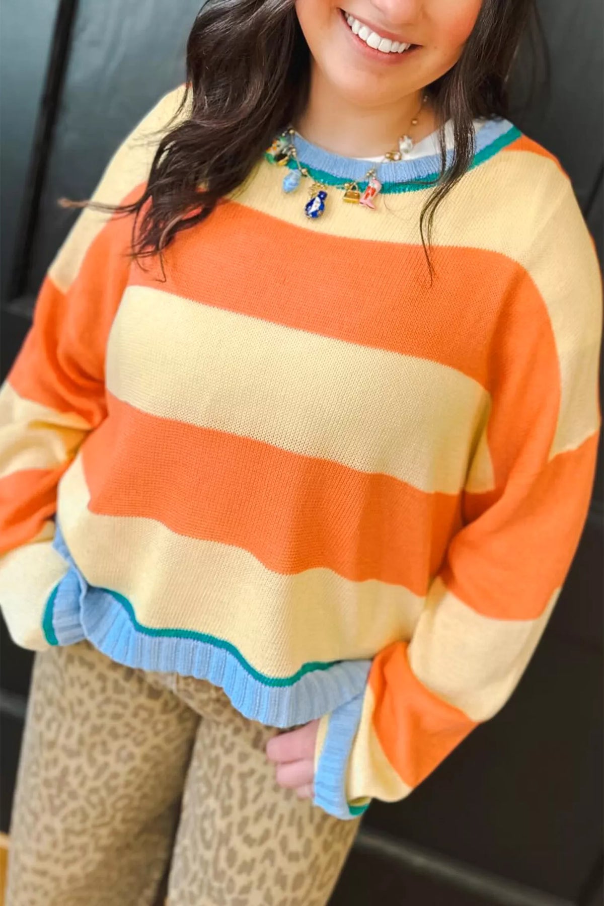 Striped colorblock sweater, orange yellow striped angled front