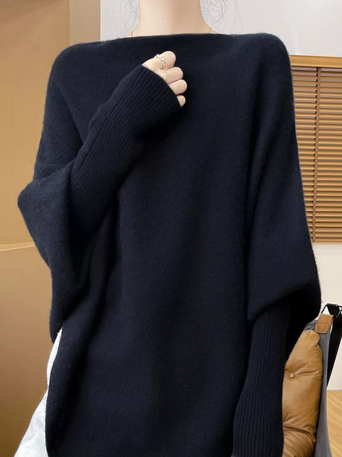 Navy asymmetrical lantern sleeve sweater — front view